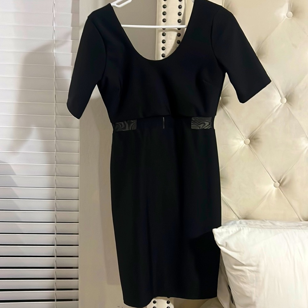 Black elegant sheer mid drift , doesn’t show belly button